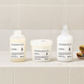 Davines LOVE Curl Conditioner with the LOVE Curl range on a bathroom shelf