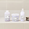 Davines LOVE Smoothing Conditioner with the LOVE Smoothing range on a bathroom shelf